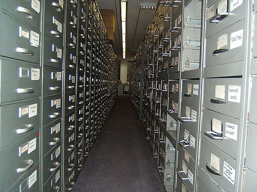 Custom Database Business Knowledge Image in Outsource Workers - Large Row of Large Steel File Cabinets